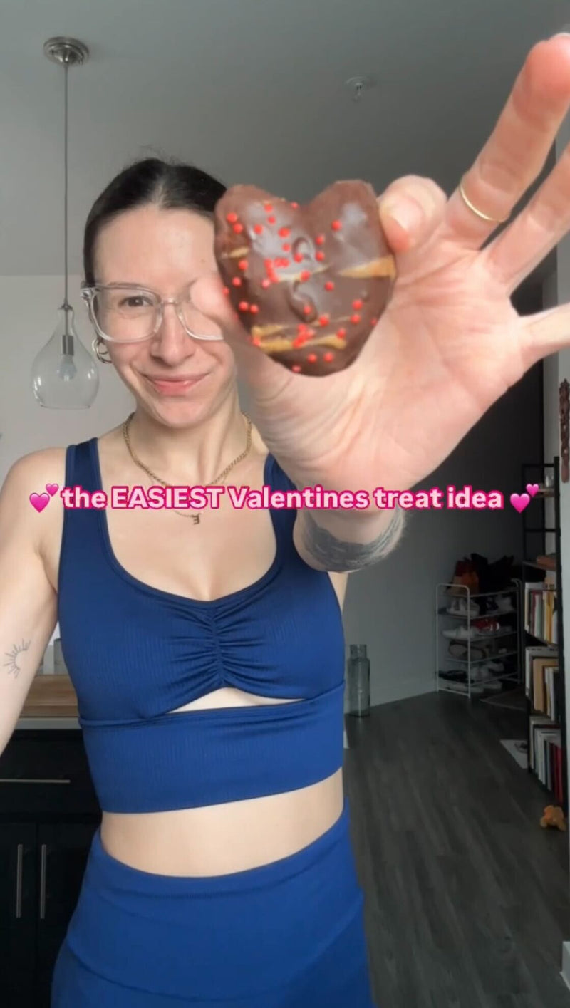 Person holding chocolate-dipped heart-shaped date with red sprinkles; overlay reads ‘the EASIEST Valentines treat idea’